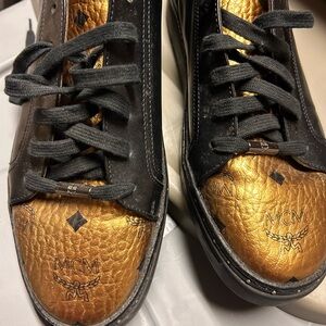 MCM Men's Luxurious Black and Gold Sneakers
